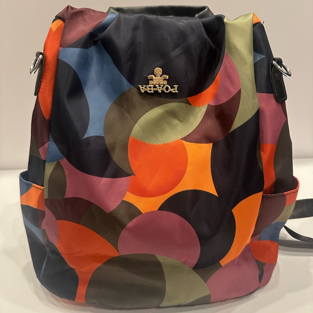 Red and Black Backpack with Geometric Pattern and Structured Design
